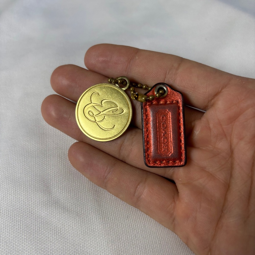 Coach x Estee Lauder Keychain Bag Charm Metallic Orange Leather Gold Medallion